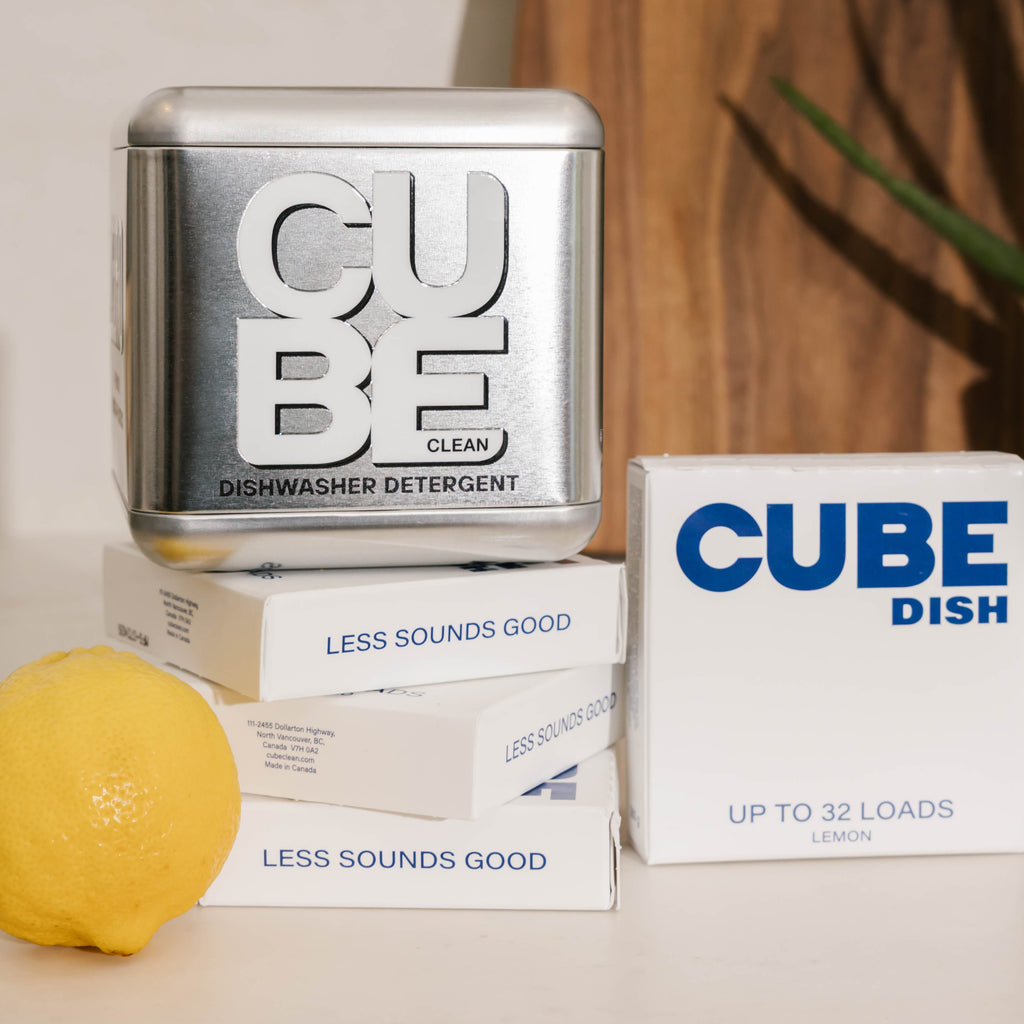Reusable CUBE metal dishwasher detergent tin with CUBE Dish boxes and a lemon